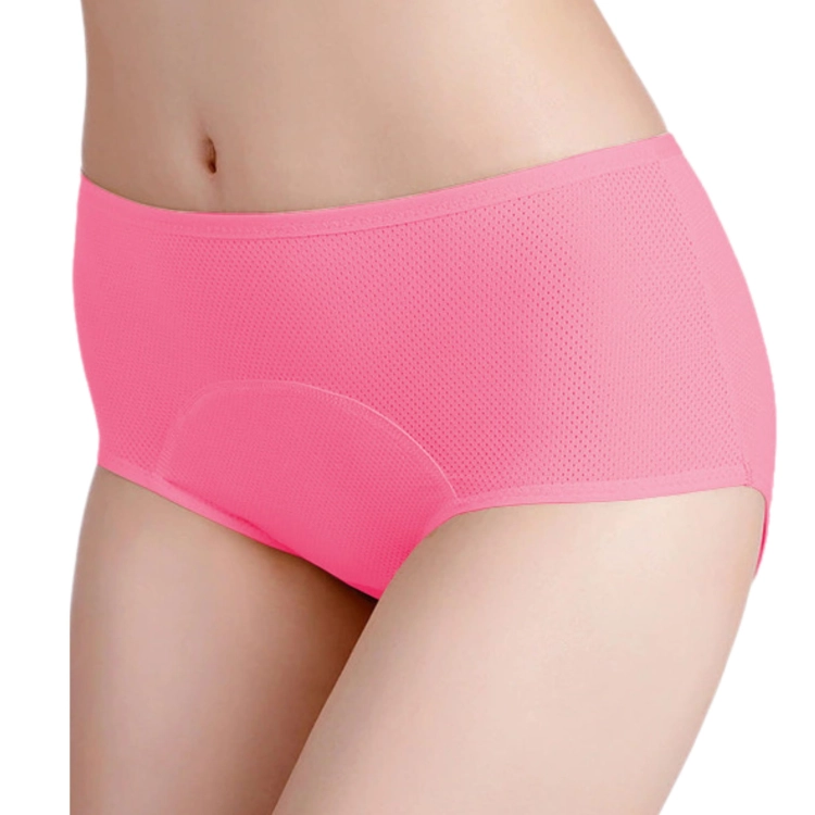 Detal wnętrza czerwonych majtek menstruacyjnych z widoczną szarą wkładką chłonną.